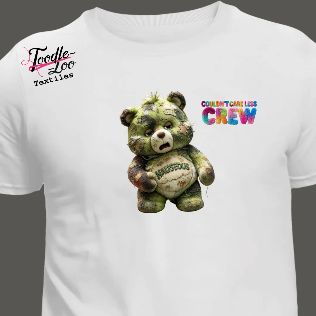 Nauseous bear design on a white tee — Couldn’t Care Less Crew DTF print, shown as an AI mock-up