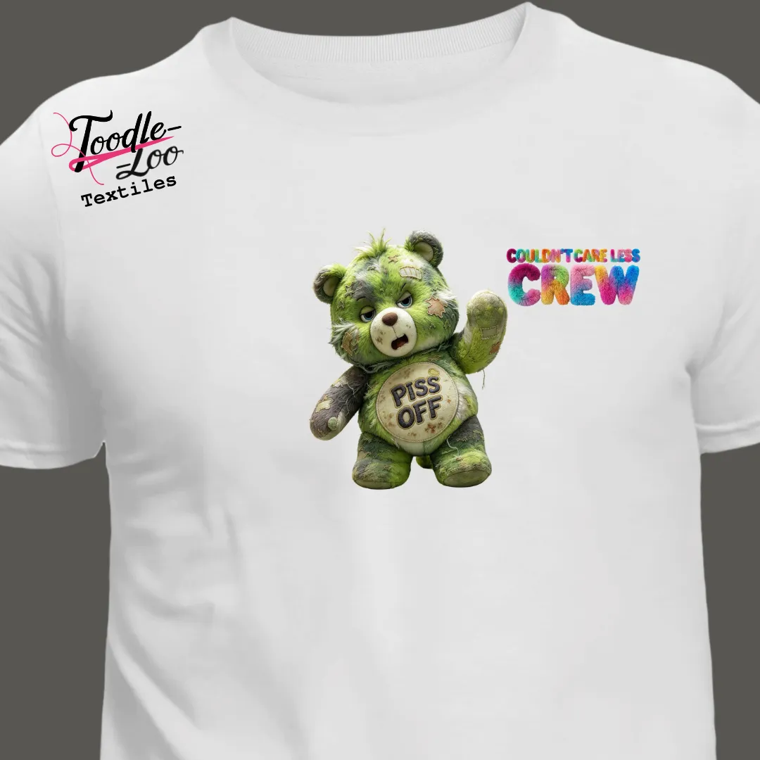 Piss Off bear design on a white tee — Couldn’t Care Less Crew DTF print, shown as an AI mock-up