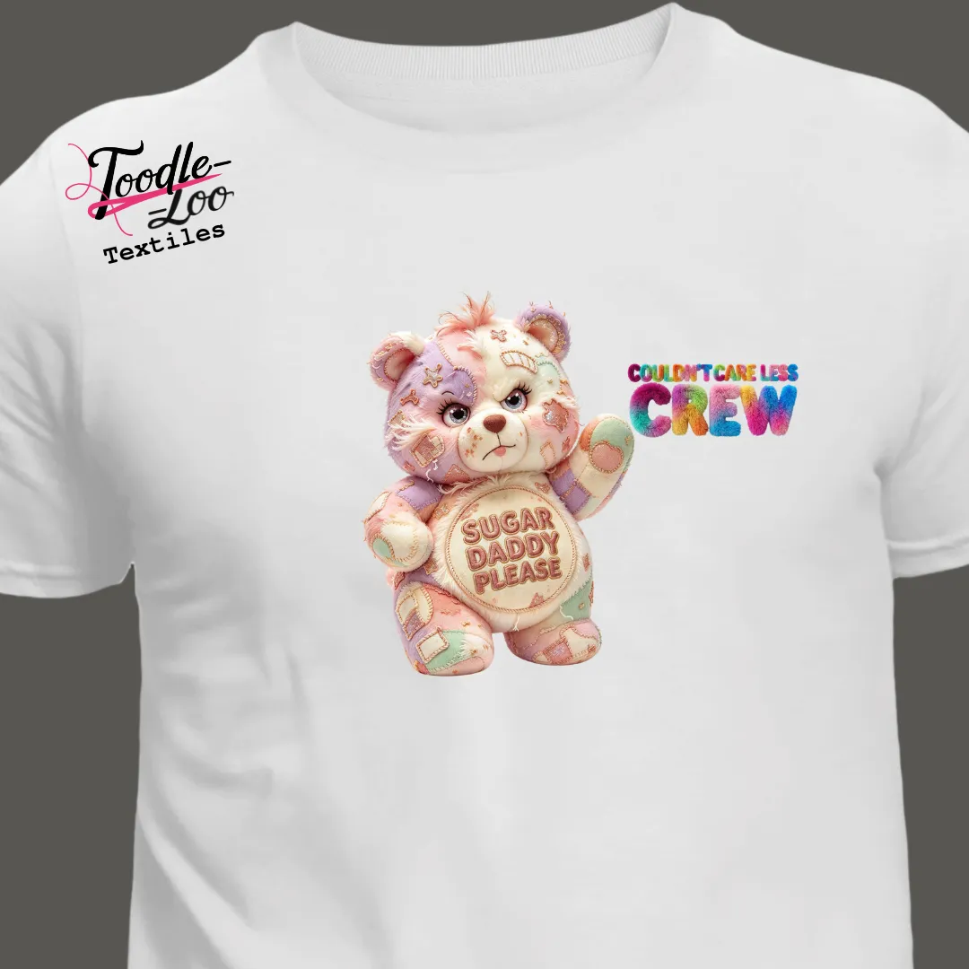 Sugar Daddy Please bear design on a white tee — Couldn’t Care Less Crew DTF print, shown as an AI mock-up