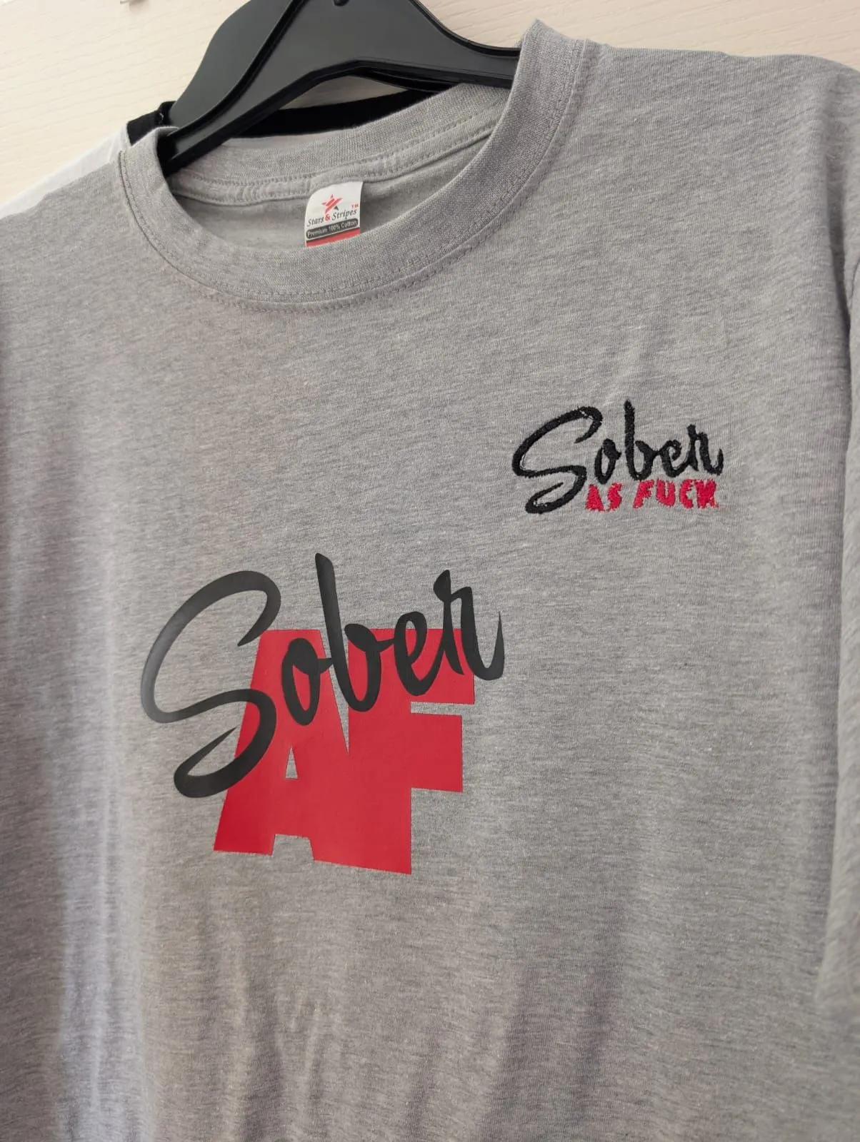Grey T-shirt with a black and red embroidered ‘Sober as F***’ design