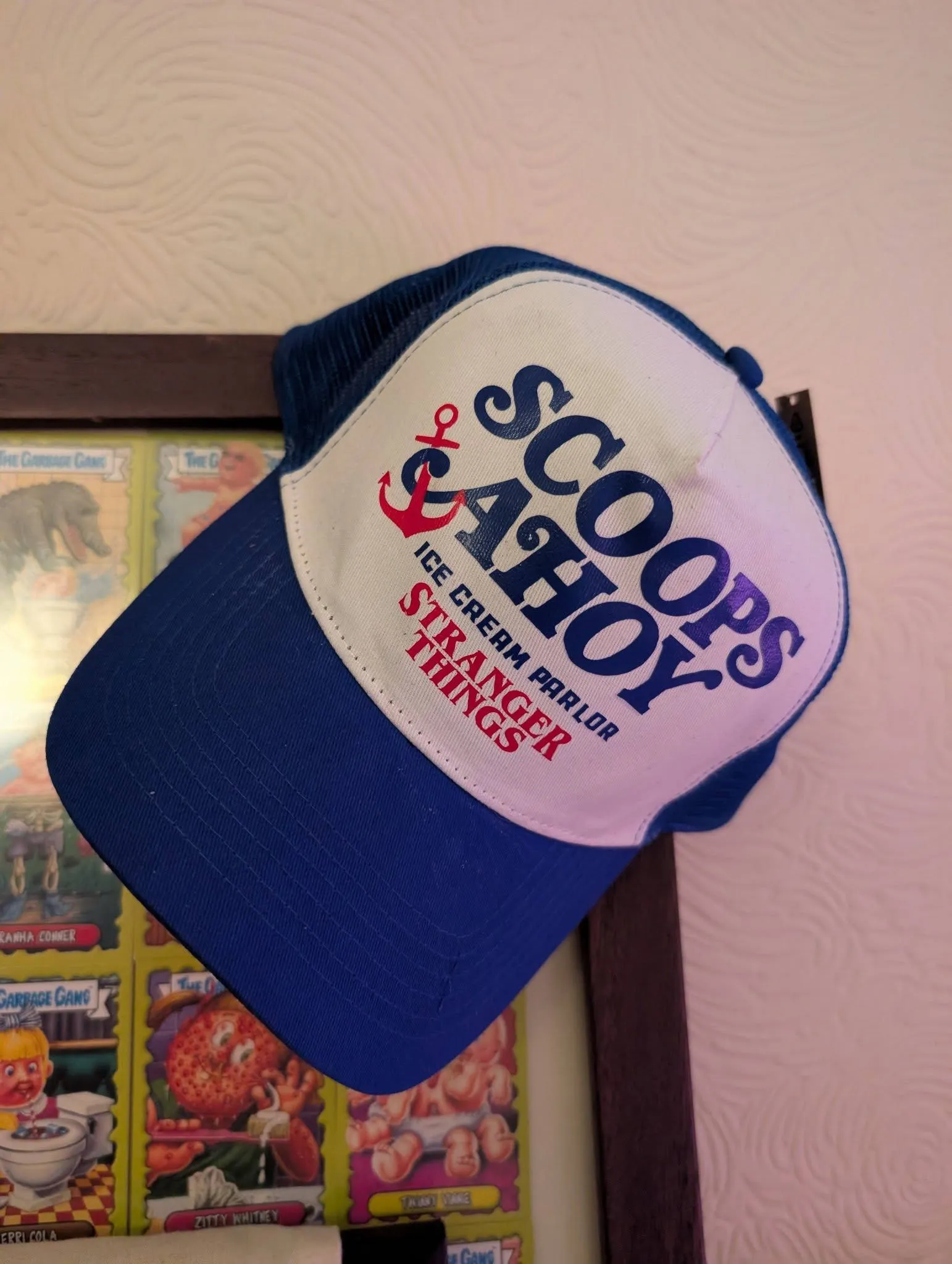 Blue and cream trucker cap with a colourful custom The Goonies graphic and lettering