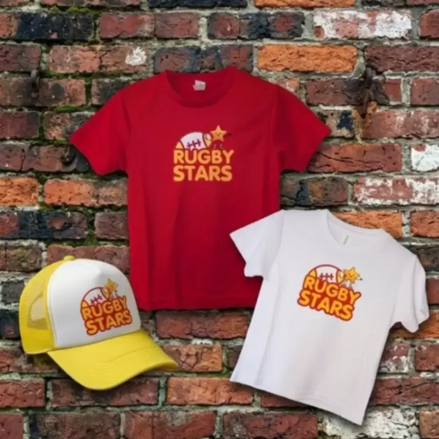 Red and white children's tees and a yellow cap with matching Rugby Stars vinyl designs